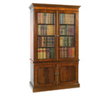 Mahogany bookcase with false books concealing TV